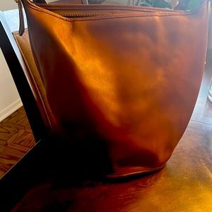 COPY - Slightly used coach bucket bag. 2spots on bottom Covered by the coach cl…